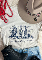 Mean, Kind, Strong, Divine Heather Natural Short Sleeve Tee with Navy Ink tcc graphic tee The Cinchy Cowgirl
