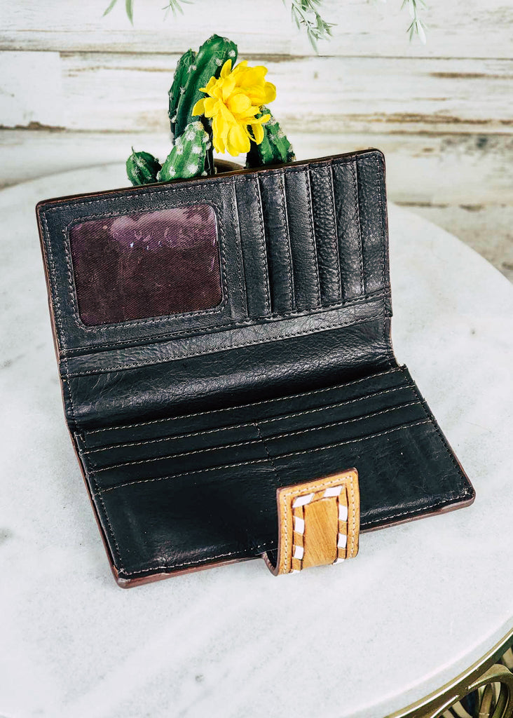 western wallet inside view on white table with cactus decor