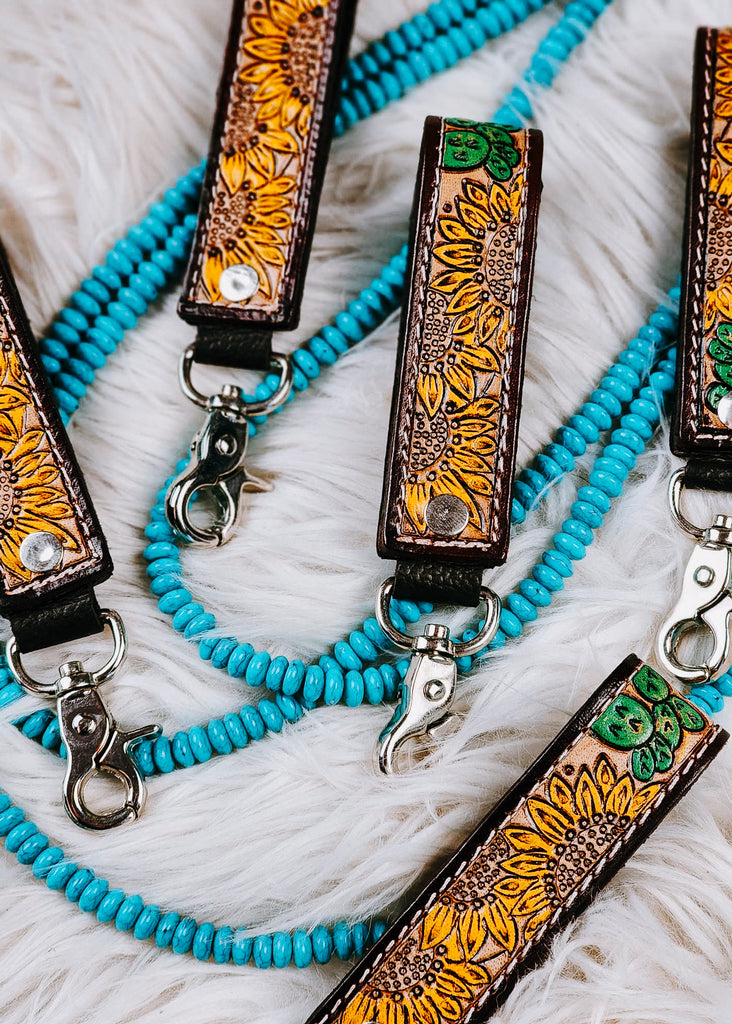Sunflower Cactus Leather Keyring on white fluffy rug with turquoise beads