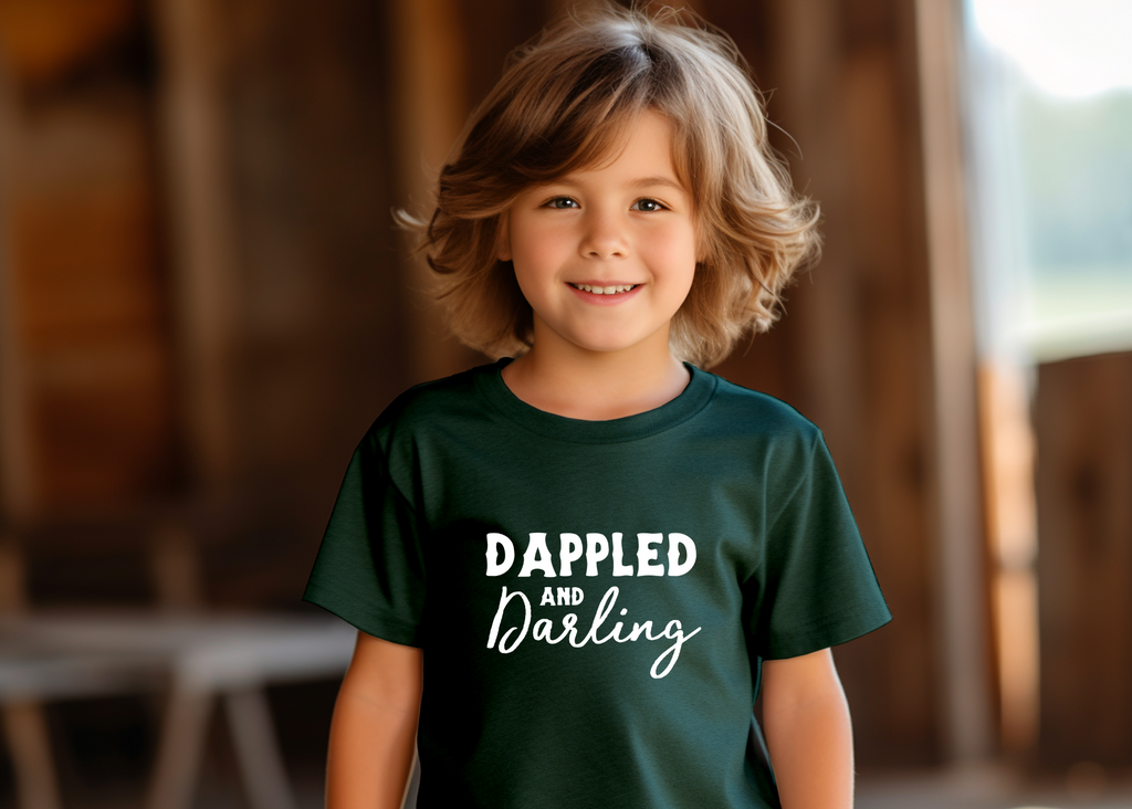 Forest youth short sleeve with white lettering reading "Dappled and Darling". 