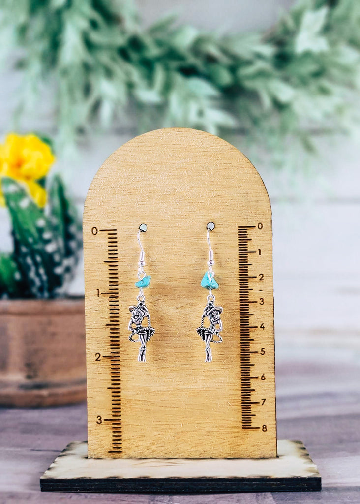 Vintage Cowgirl and Turquoise Earrings on wood background with green decor hanging on wood measurement 