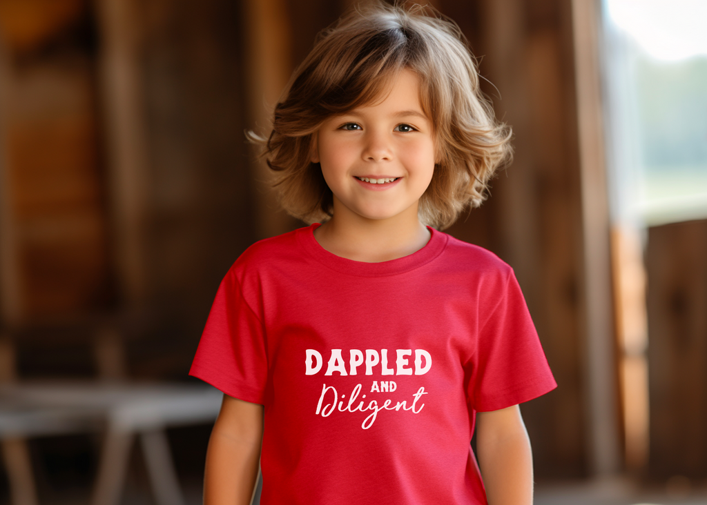 Red youth short sleeve with white lettering reading "Dappled and Diligent". 