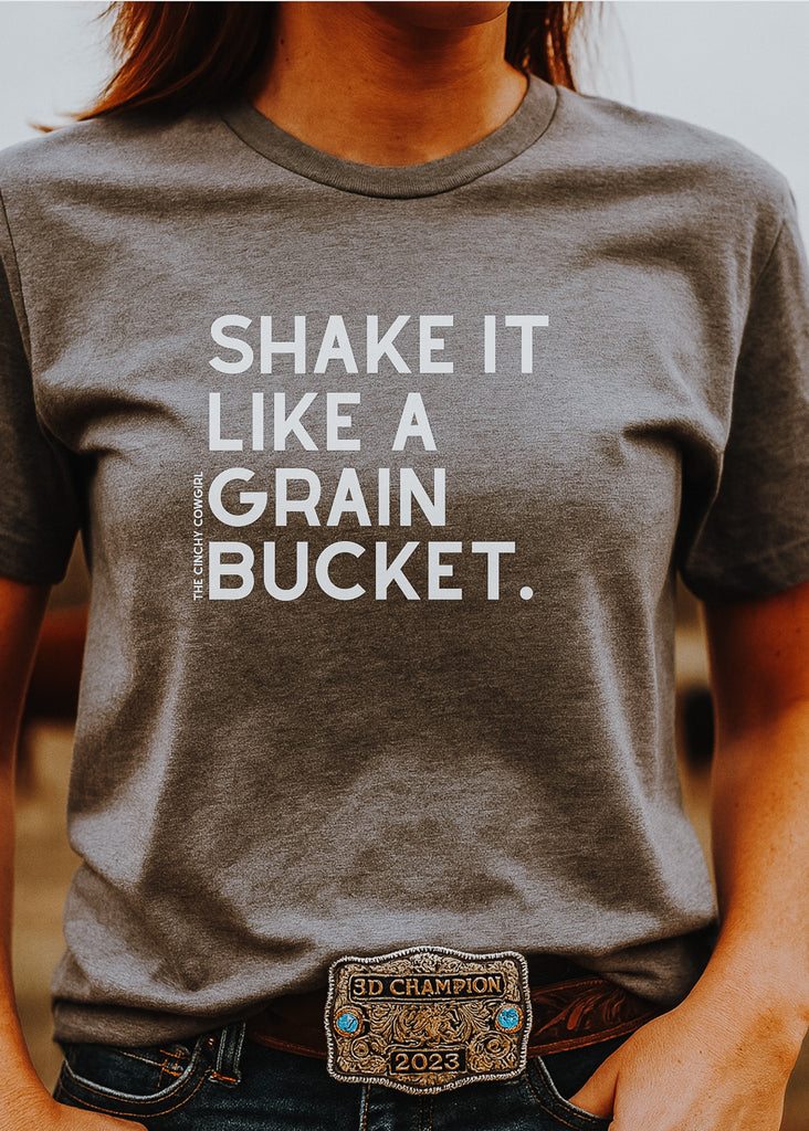 Shake It Like A Grain Bucket Short Sleeve Graphic Tee [16 Colors] Short Sleeve Graphic Tee The Cinchy Cowgirl