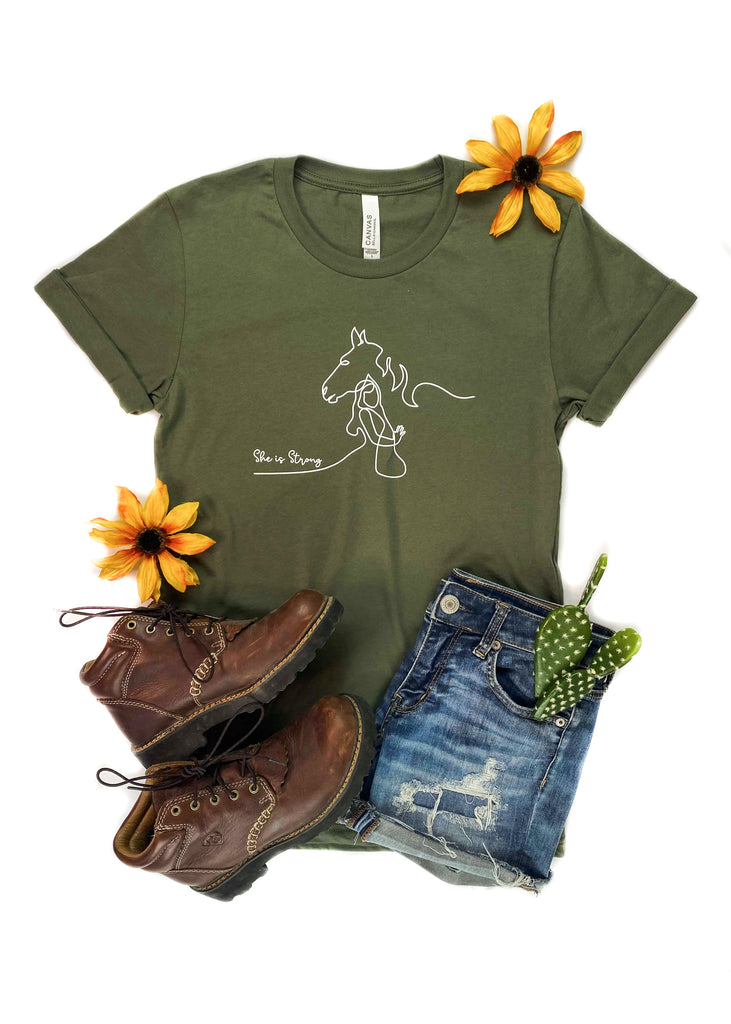 She is Strong Horse Army Green Short Sleeve Graphic Tee tcc graphic tee The Cinchy Cowgirl   