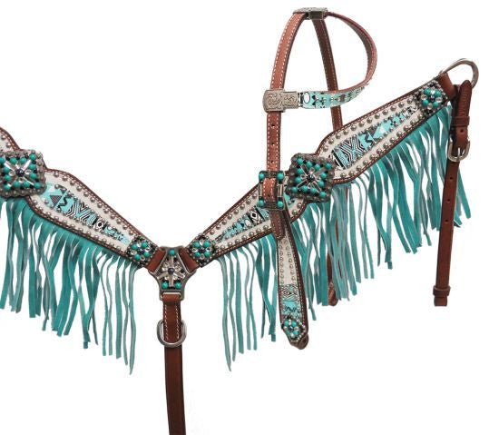 Turquoise headstall set with turquoise fringe on the breast collar. Turquoise tribal print and turquoise colored stones on the conchos on the breast collar and headstalls. 