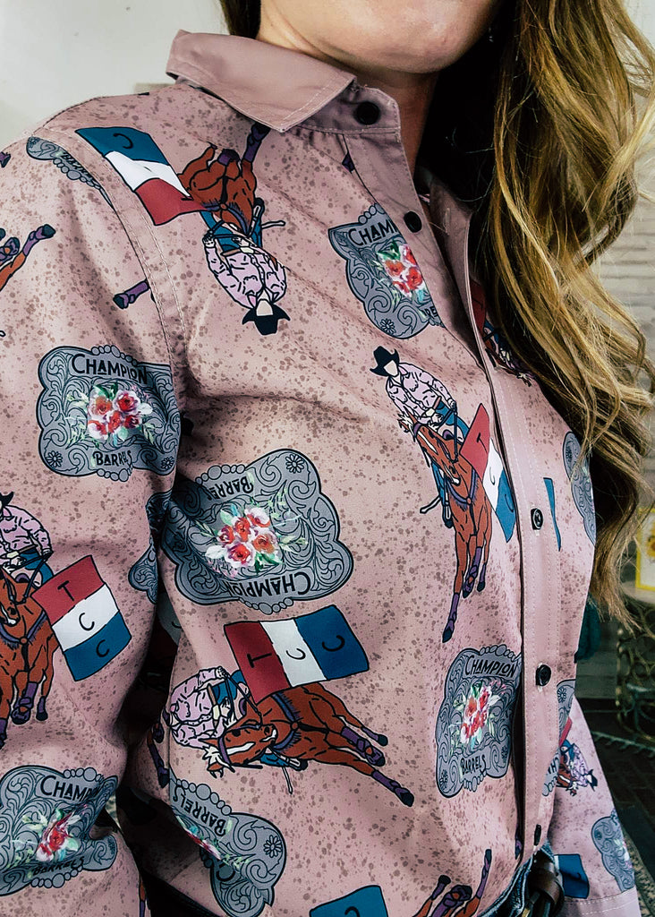 Champion Buckle Barrel Racer Long Sleeve Button DownChampagne button down with barrel racer and champion buckle printed on shirt. Shirt is zoomed in on model. 