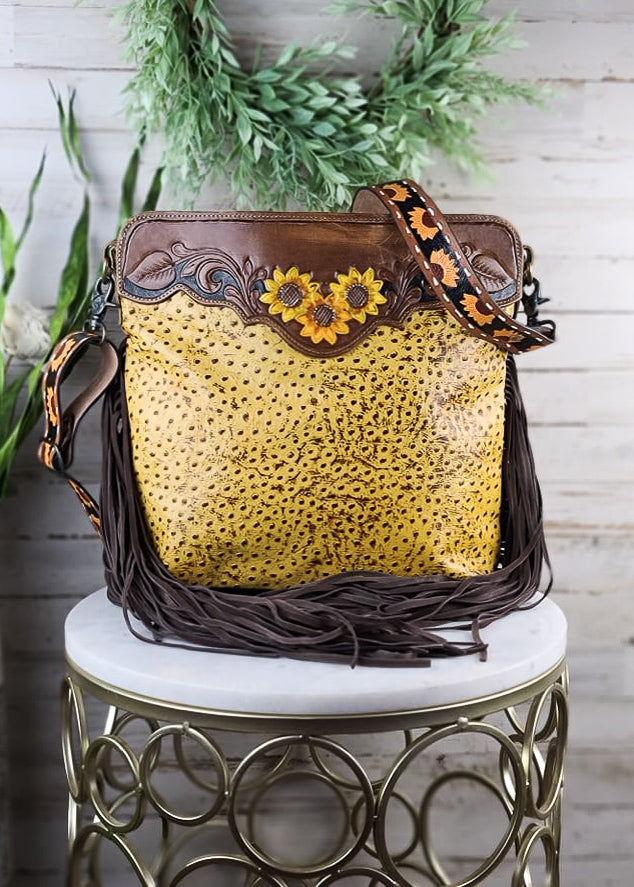 Drops of Sun Yellow Handbag on white table with green decor