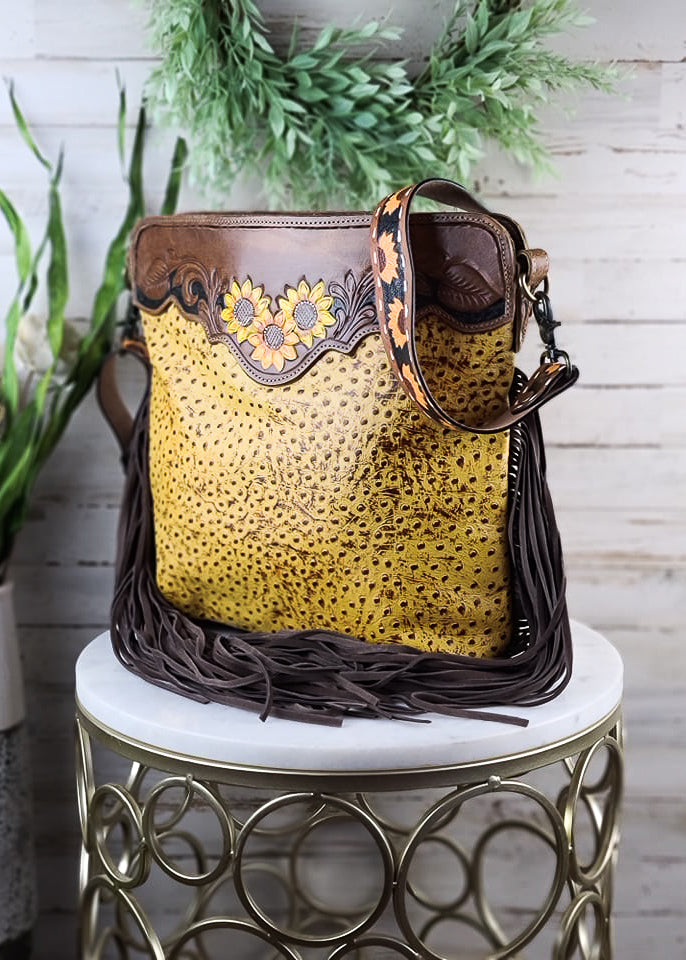 Drops of Sun Yellow Handbag on white table with green decor