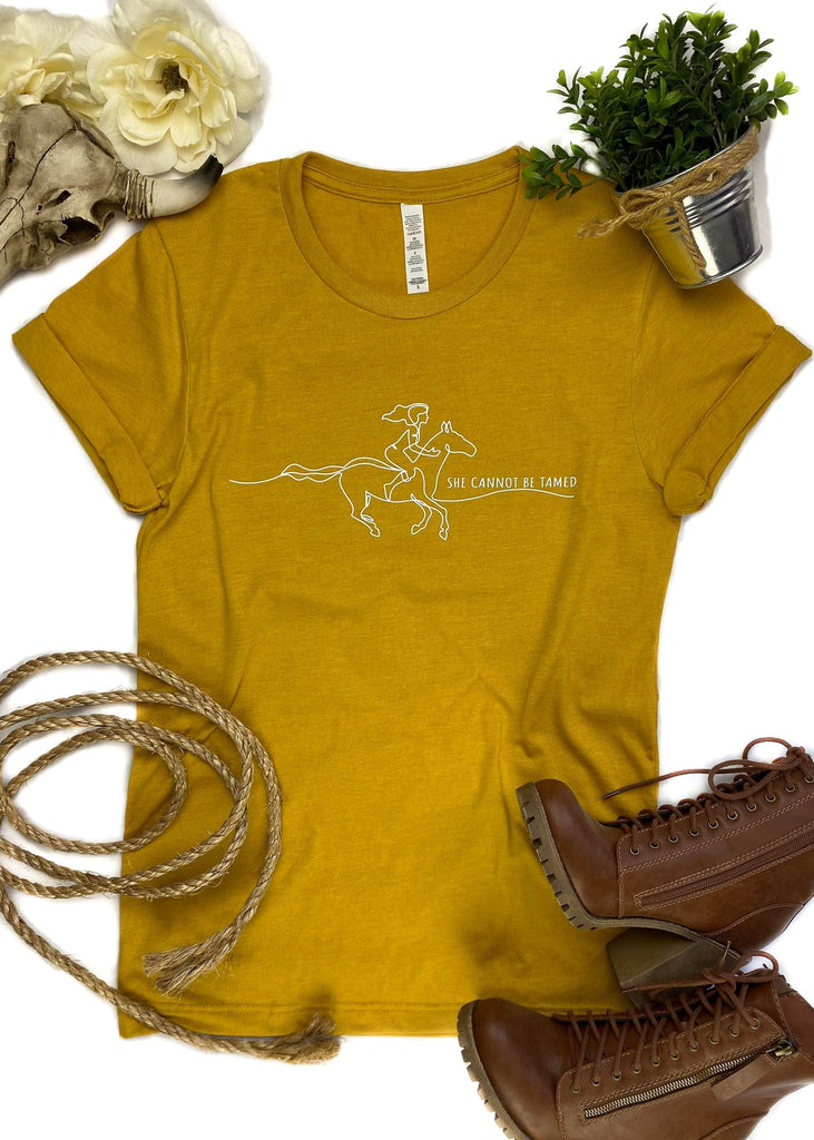 Mustard She Cannot Be Tamed Short Sleeve Graphic Tee tcc graphic tee The Cinchy Cowgirl   