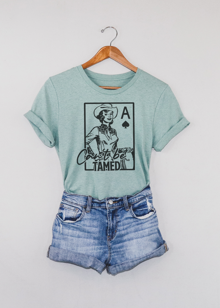 Can't Be Tamed Short Sleeve Tee [4 colors] tcc graphic tee - $19.99 The Cinchy Cowgirl Small Dusty Blue 