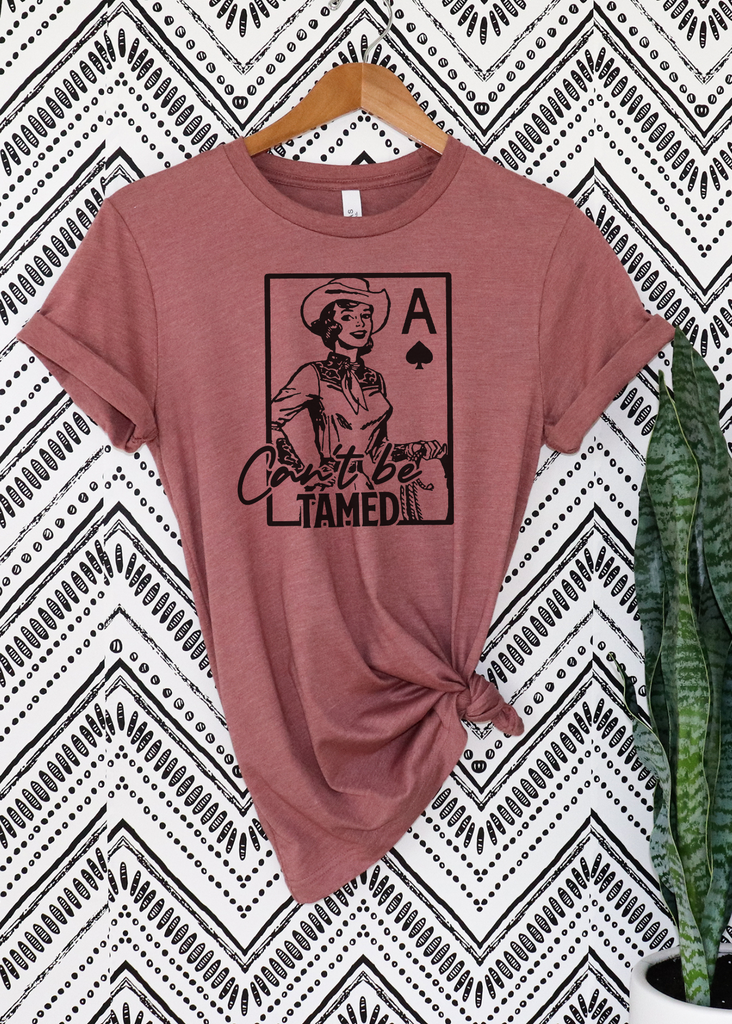 Can't Be Tamed Short Sleeve Tee [4 colors] tcc graphic tee - $19.99 The Cinchy Cowgirl Small Mauve 