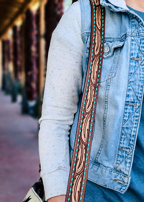 Teal Buckstitch Feather Purse Strap on model outside