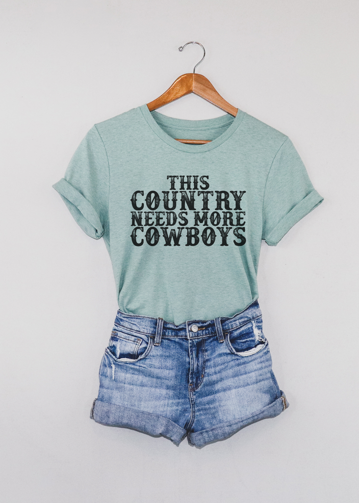 This Country Needs More Cowboys Short Sleeve Tee [4 colors] tcc graphic tee - $19.99 The Cinchy Cowgirl Small Dusty Blue 