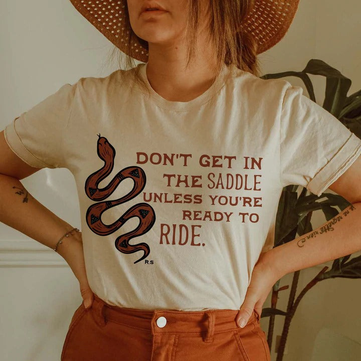 Don't Get In The Saddle Tee graphic tee - dropship thelattimoreclaim   