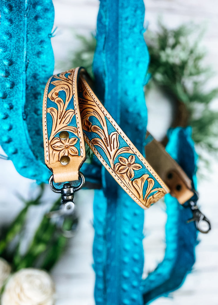 Teal Floral Purse Strap on blue cactus
