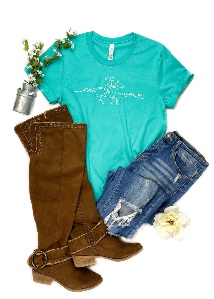 Teal She Cannot Be Tamed Short Sleeve Graphic Tee tcc graphic tee The Cinchy Cowgirl   