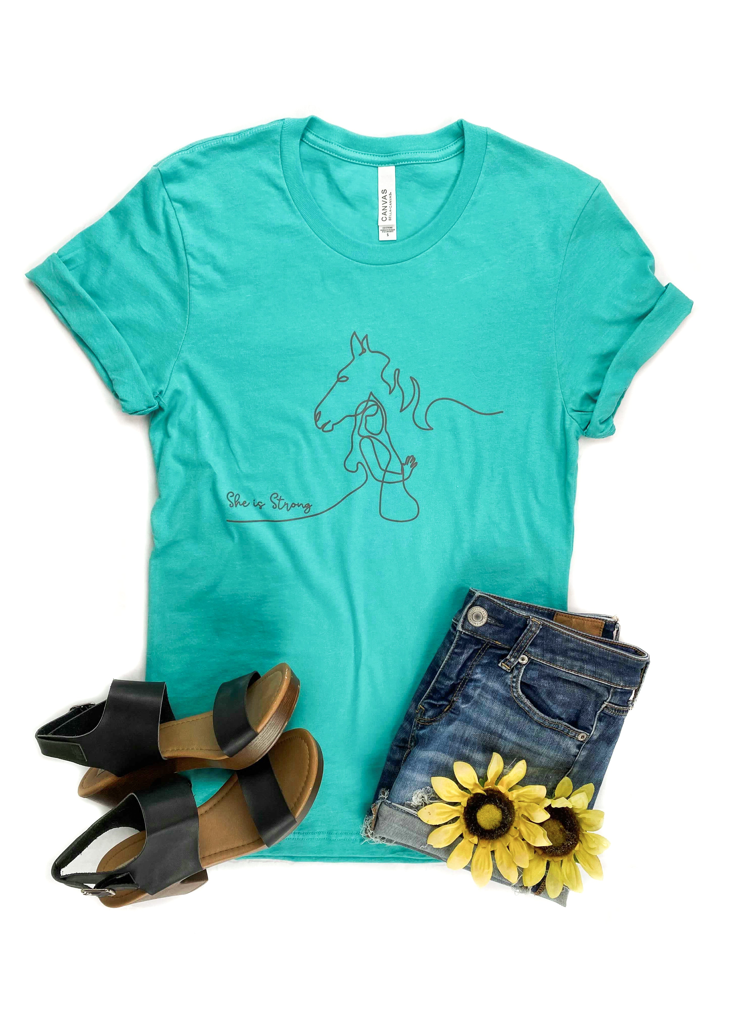 She is Strong Horse Teal Short Sleeve Graphic Tee tcc graphic tee The Cinchy Cowgirl   